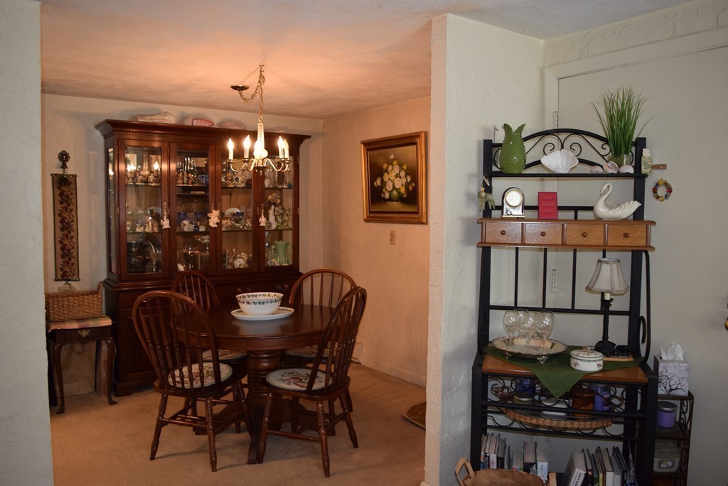 140 Swanson Road, Unit 413 Boxborough, MA 01719 - Photo 6 of 26 a view of a dining room with furniture