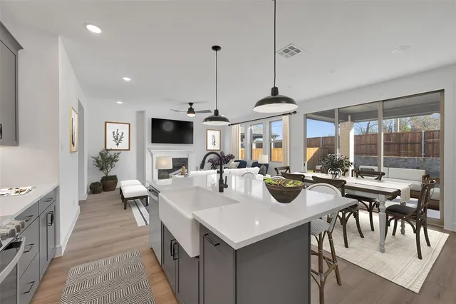 a kitchen with lots of counter space dining table and chairs