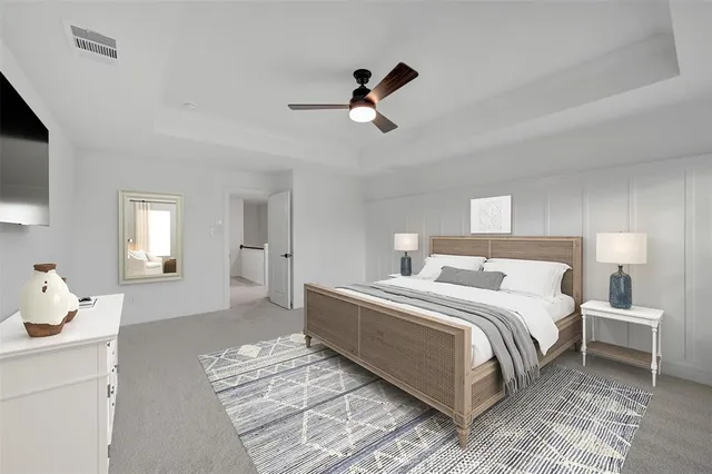 a spacious bedroom with a bed and window