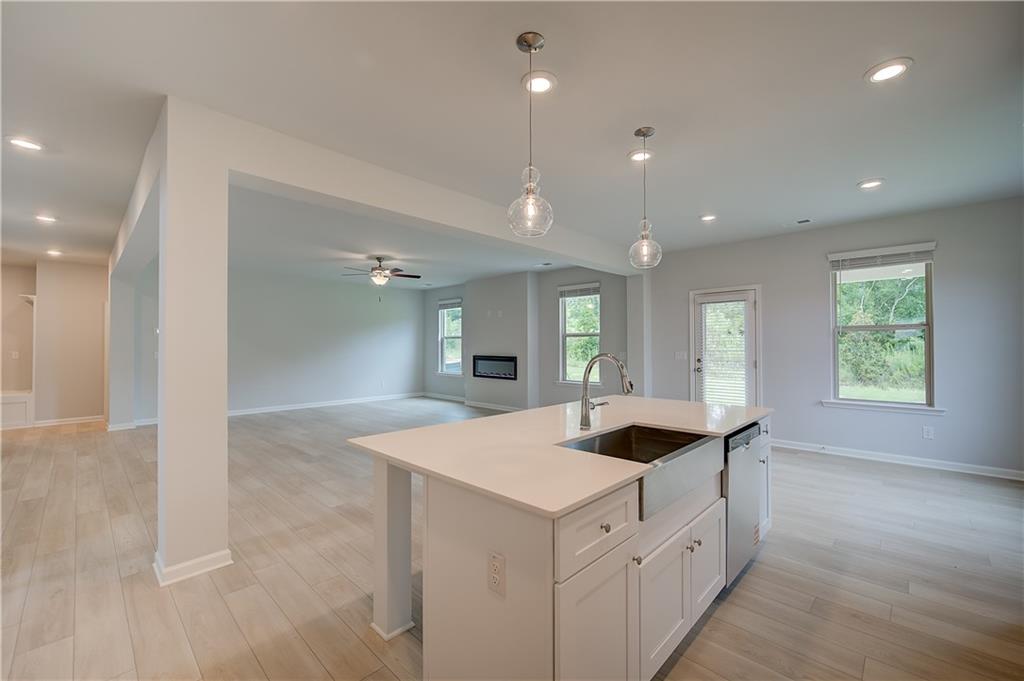 709 Dunlake Way Locust Grove, GA 30248 - Photo 11 of 34 a kitchen with sink and mirror