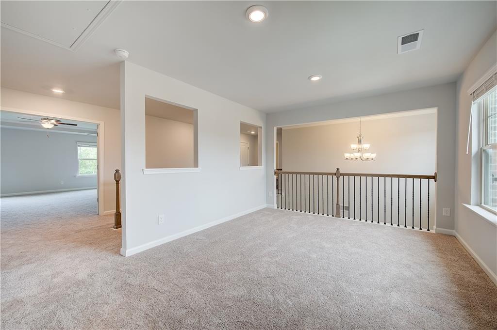 709 Dunlake Way Locust Grove, GA 30248 - Photo 18 of 34 a view of a livingroom with a staircase