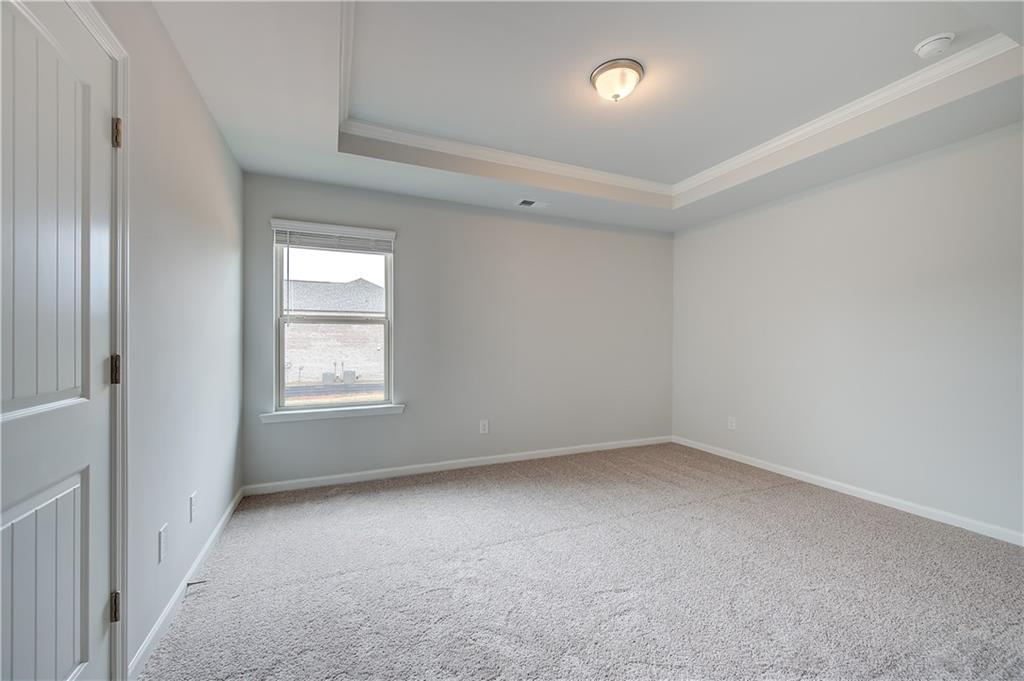 709 Dunlake Way Locust Grove, GA 30248 - Photo 20 of 34 an empty room with a window