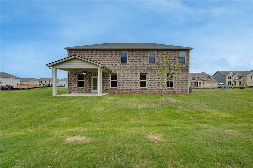 709 Dunlake Way Locust Grove, GA 30248 - Photo 32 of 34 a view of a house with a backyard