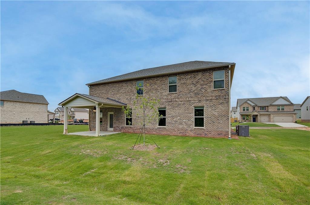 709 Dunlake Way Locust Grove, GA 30248 - Photo 34 of 34 a big house with a big yard and more windows