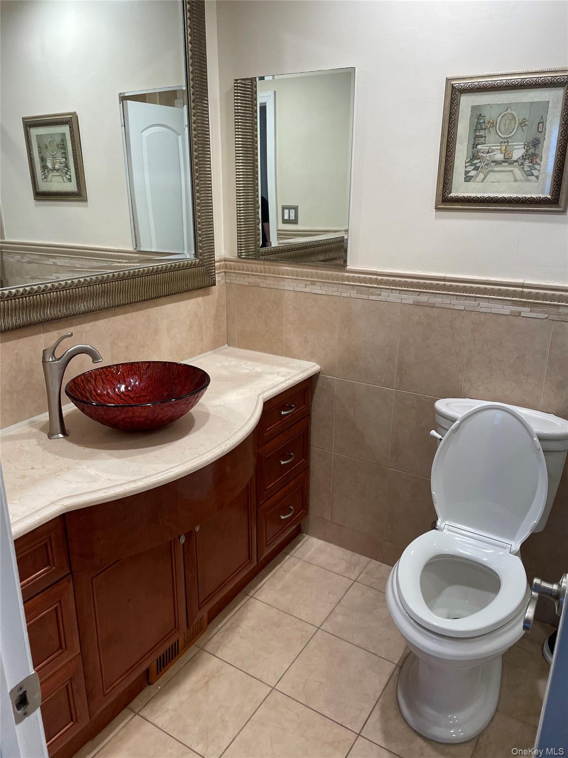 20-23 Whitestone Expressway Queens, NY 11357 - Photo 16 of 28 a bathroom with a toilet a sink and a mirror
