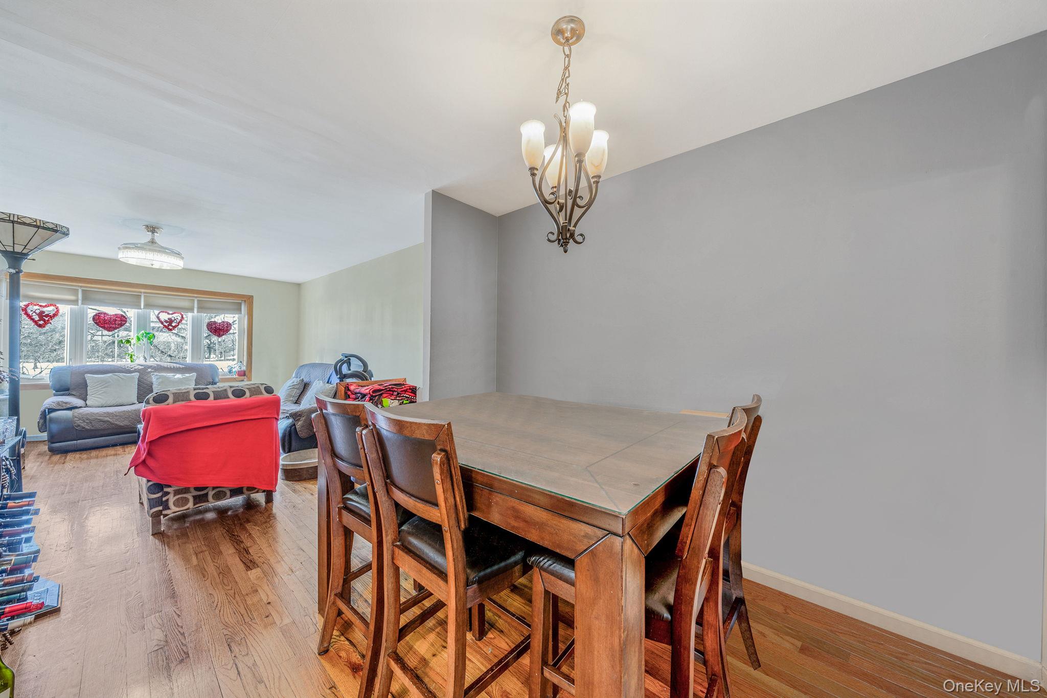 20-23 Whitestone Expressway Queens, NY 11357 - Photo 5 of 28 a view of a dining room with furniture and wooden floor