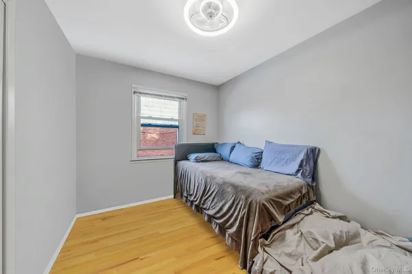 a bedroom with a bed and window