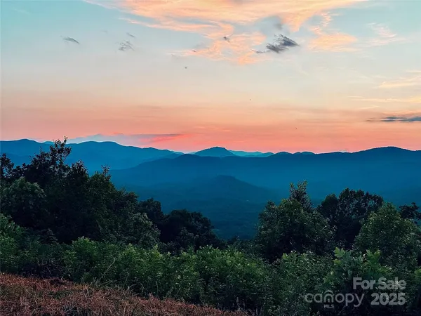 a view of a lake with mountains in the background