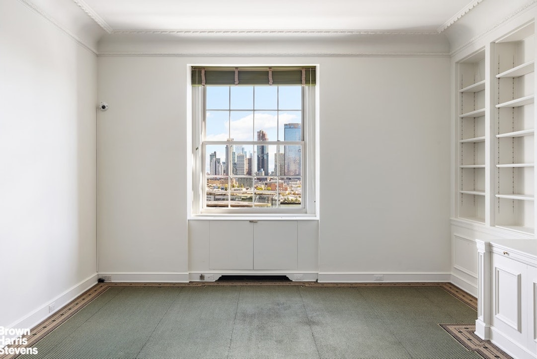 1 Sutton Place South, Unit 11C Manhattan, NY 10022 - Photo 10 of 20 an empty room with a window