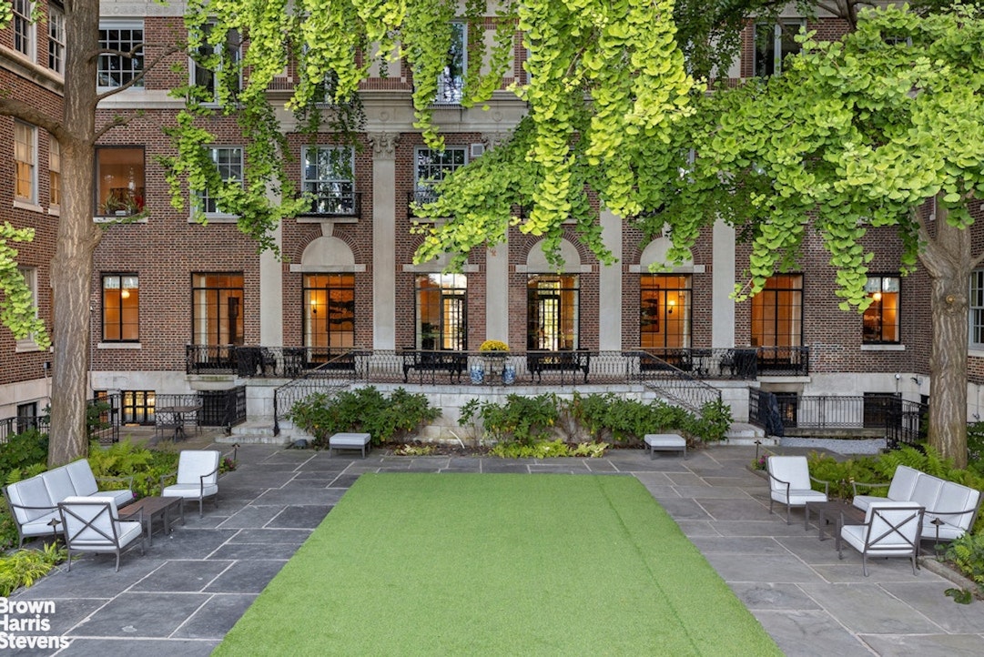 1 Sutton Place South, Unit 11C Manhattan, NY 10022 - Photo 19 of 20 a front view of a house with a garden and patio