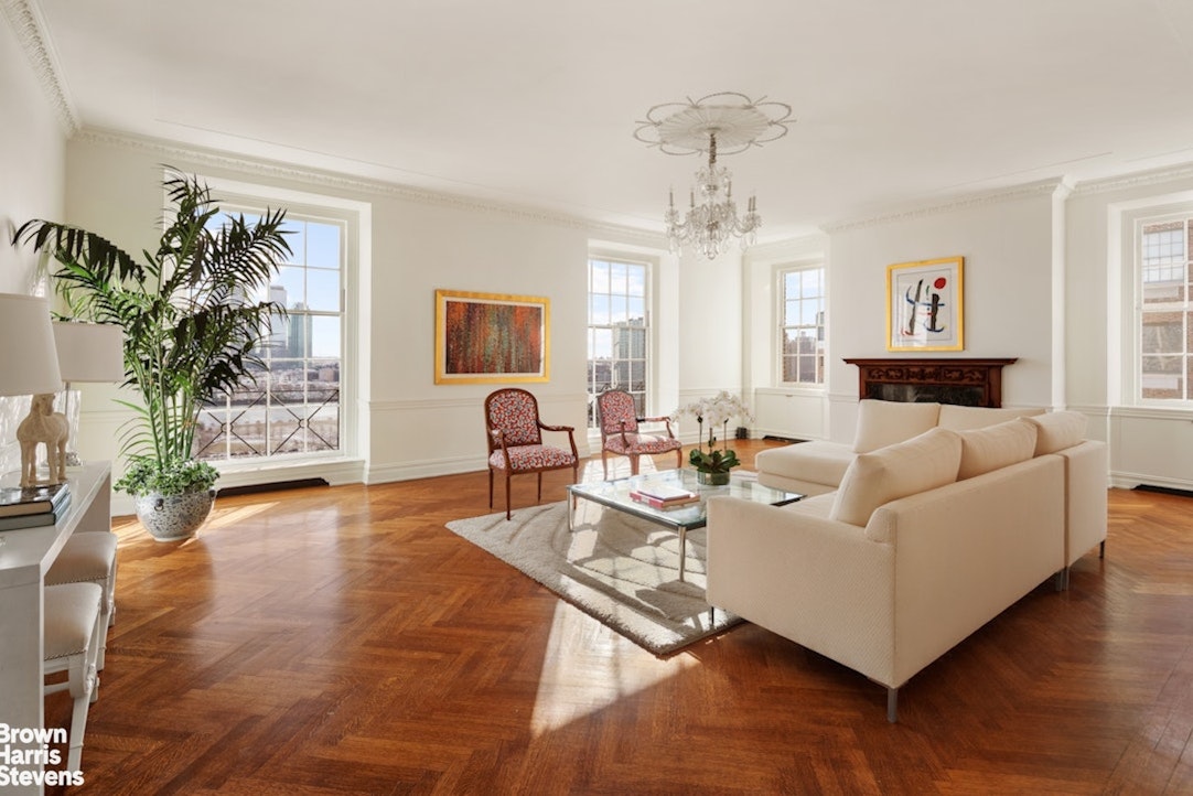 1 Sutton Place South, Unit 11C Manhattan, NY 10022 - Photo 2 of 20 a living room with furniture and a wooden floor