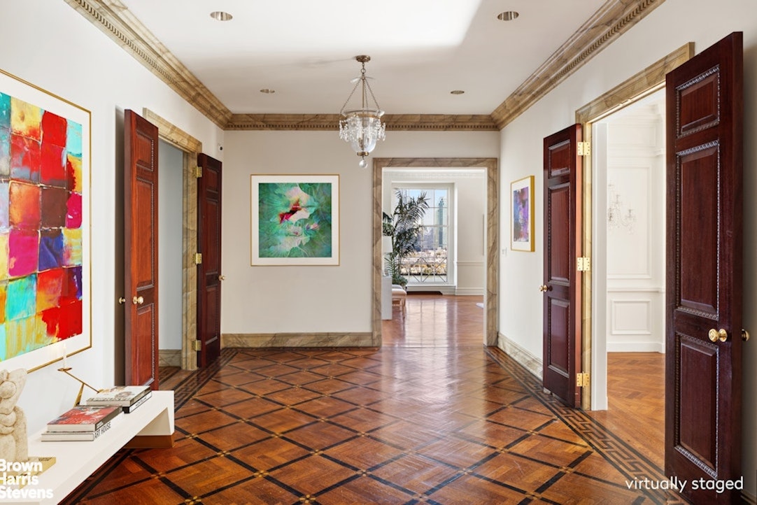 1 Sutton Place South, Unit 11C Manhattan, NY 10022 - Photo 6 of 20 a view of a hallway with wooden floor and windows