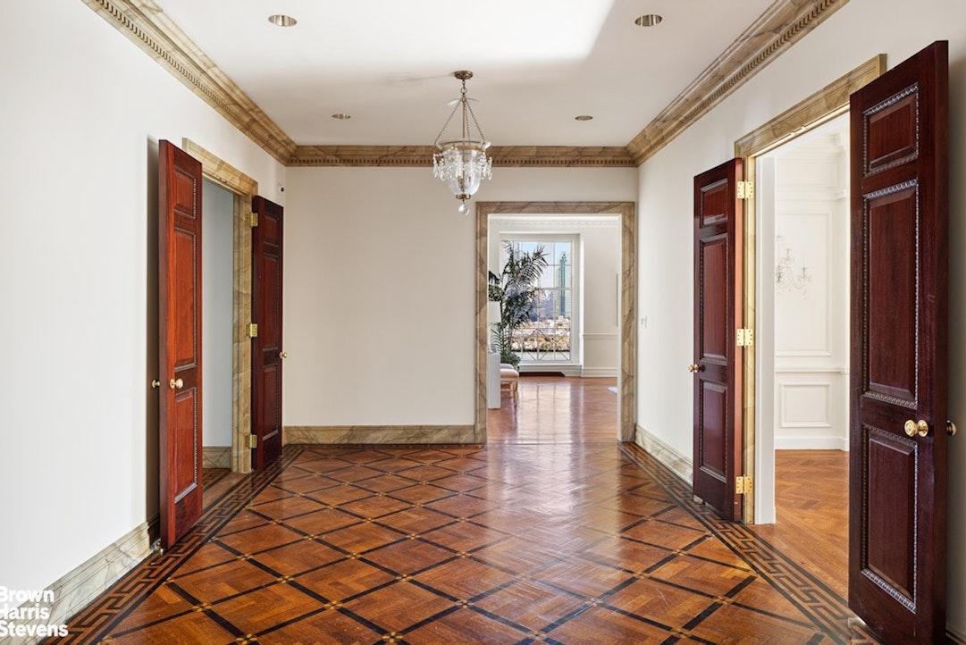 1 Sutton Place South, Unit 11C Manhattan, NY 10022 - Photo 7 of 20 a view of a hallway with wooden floor and staircase