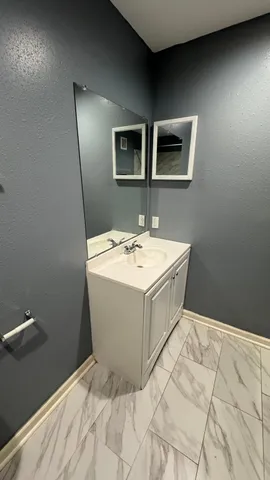 a kitchen with granite countertop cabinets and sink