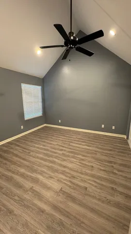 a view of an empty room with a window