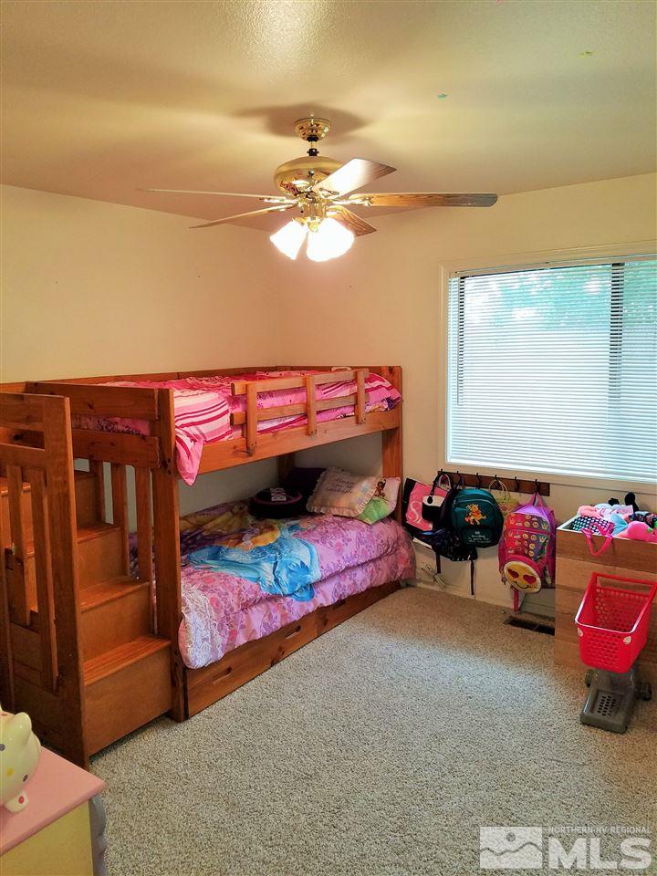 2580 Rice Road Fallon, NV 89406 - Photo 17 of 25 a bedroom with furniture and a baby crib