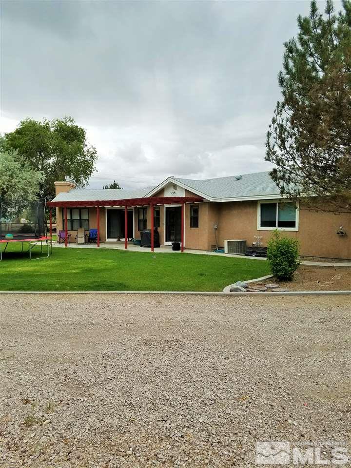 2580 Rice Road Fallon, NV 89406 - Photo 25 of 25 a view of house in front of a house with large trees