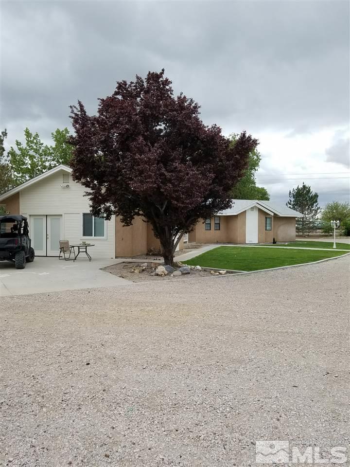 2580 Rice Road Fallon, NV 89406 - Photo 5 of 25 a house with a tree in front of it
