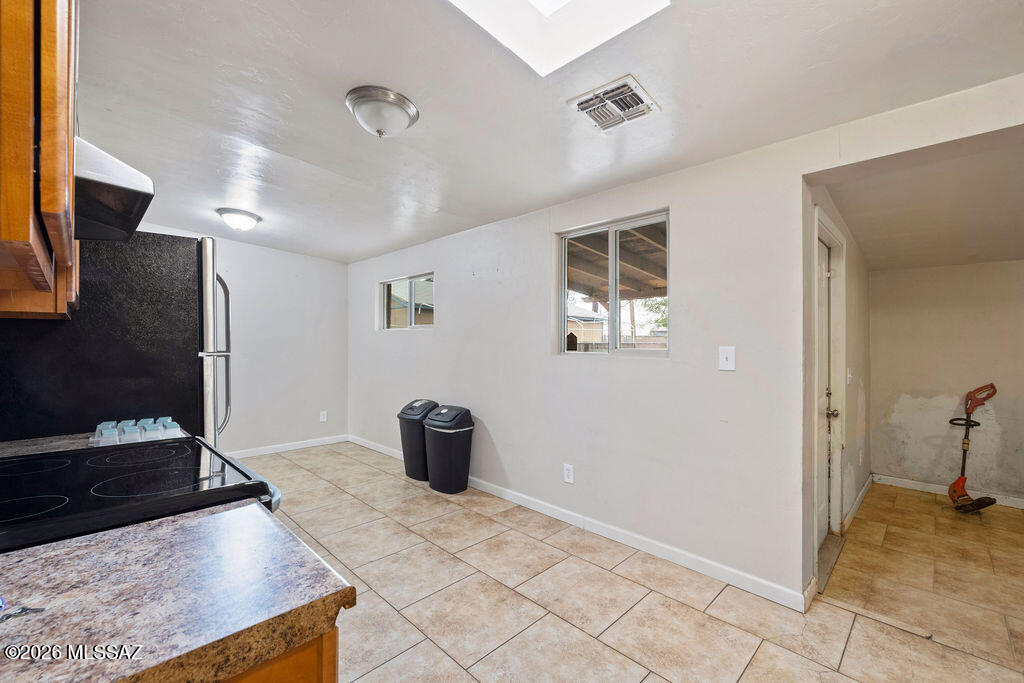 1301 West Kleindale Road Tucson, AZ 85705 - Photo 12 of 27 a view of a kitchen with wooden floor and a sink