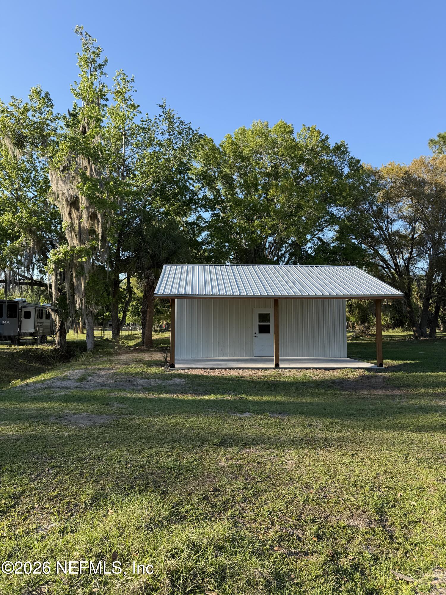 1133 Turnbull Grove Road Oak Hill, FL 32759 - Photo 3 of 14 a front view of a house with a yard