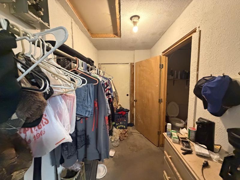 9300 Johns Road Alvarado, TX 76009 - Photo 31 of 40 a view of walk in closet with clothes and shoes