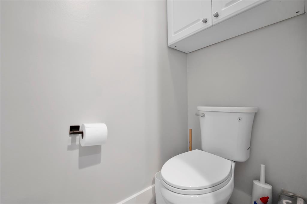 142 Morning Dew Circle, Unit 142 Jupiter, FL 33458 - Photo 18 of 34 a white toilet sitting next to a white cabinet
