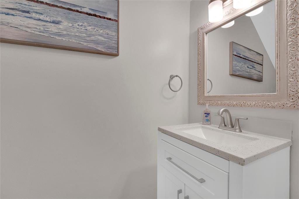 142 Morning Dew Circle, Unit 142 Jupiter, FL 33458 - Photo 25 of 34 a bathroom with a sink and a mirror