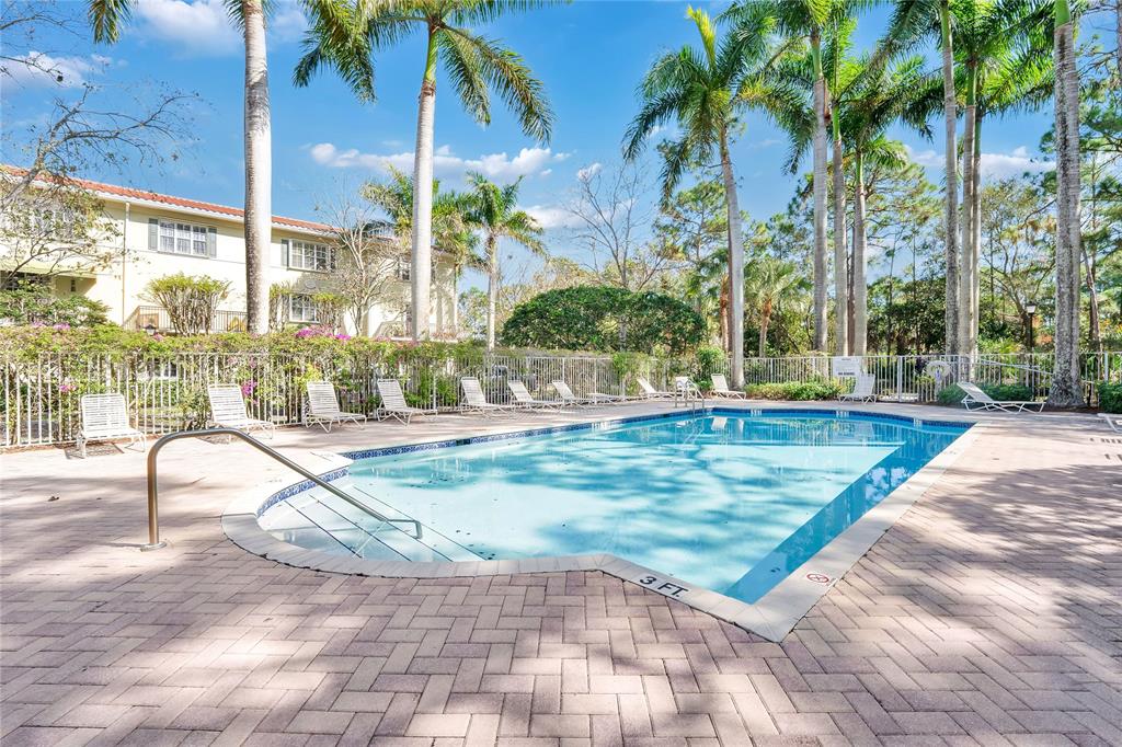 142 Morning Dew Circle, Unit 142 Jupiter, FL 33458 - Photo 28 of 34 a view of a swimming pool with a patio