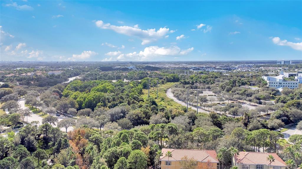 142 Morning Dew Circle, Unit 142 Jupiter, FL 33458 - Photo 31 of 34 a view of a city with lush green forest
