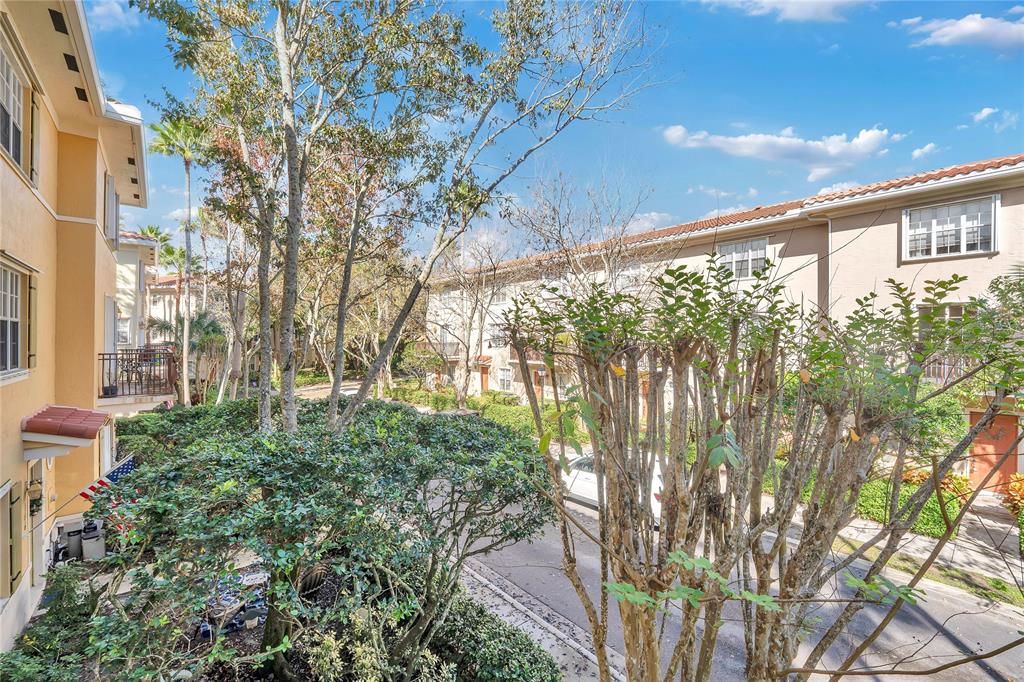 142 Morning Dew Circle, Unit 142 Jupiter, FL 33458 - Photo 5 of 34 a view of a large tree with a yard