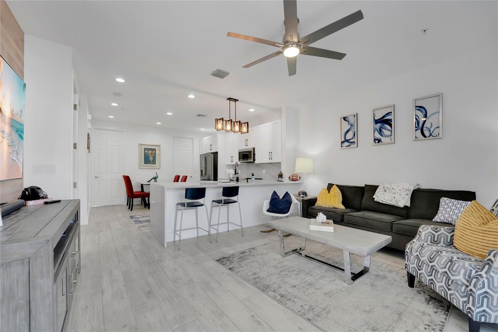 142 Morning Dew Circle, Unit 142 Jupiter, FL 33458 - Photo 8 of 34 a living room with furniture and a window