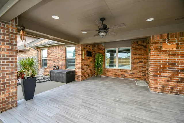 a view of a livingroom with furniture and a window