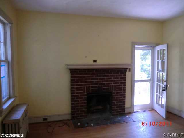 4600 Brook Road Richmond, VA 23227 - Photo 4 of 12 a living room with a fireplace