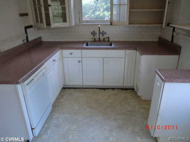 4600 Brook Road Richmond, VA 23227 - Photo 7 of 12 a kitchen with a sink and cabinets