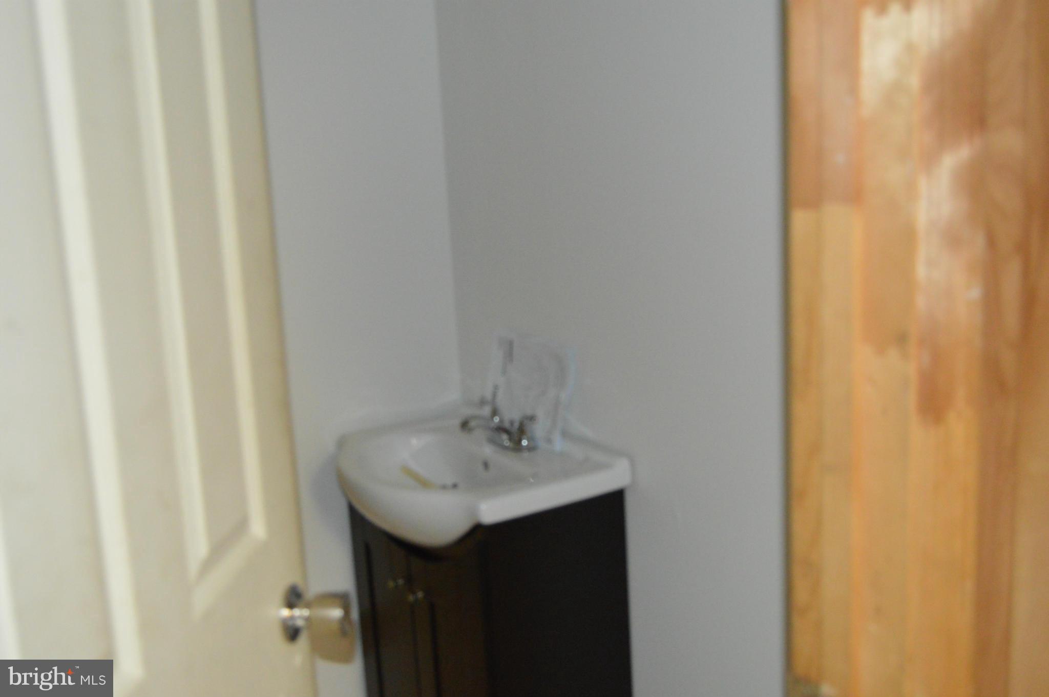 7464 Race Road Hanover, MD 21076 - Photo 19 of 27 Lower Powder Room