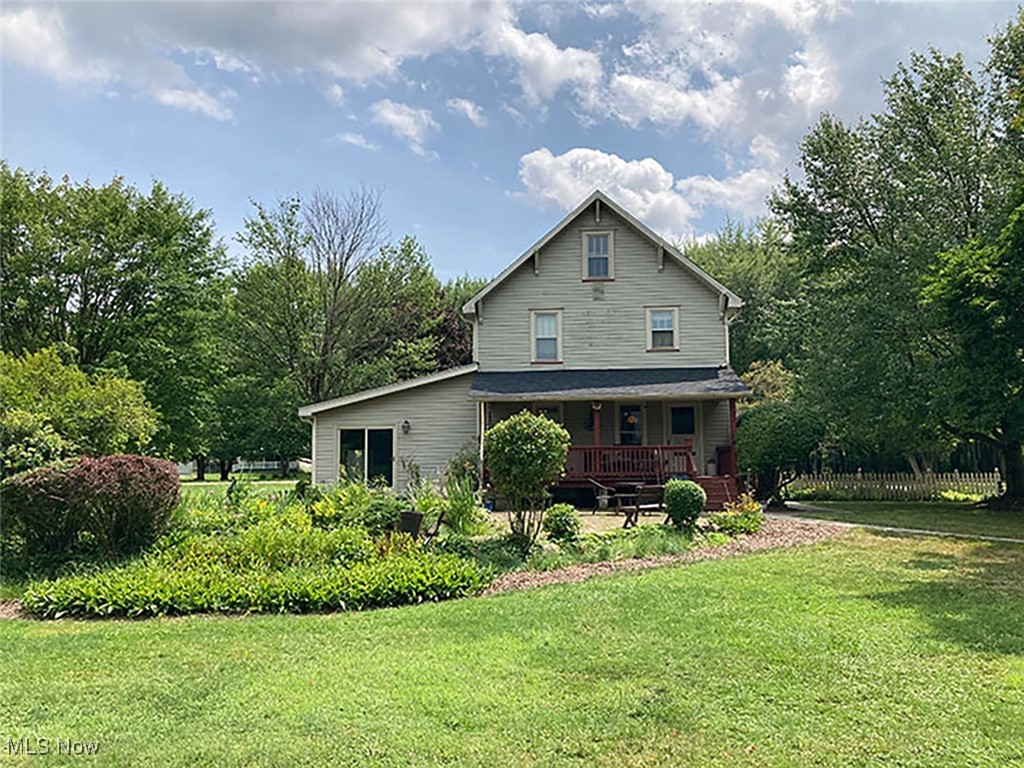 8309 Drake State Line Road Masury, OH 44438 - Photo 5 of 34 Back of property featuring a yard and covered porch