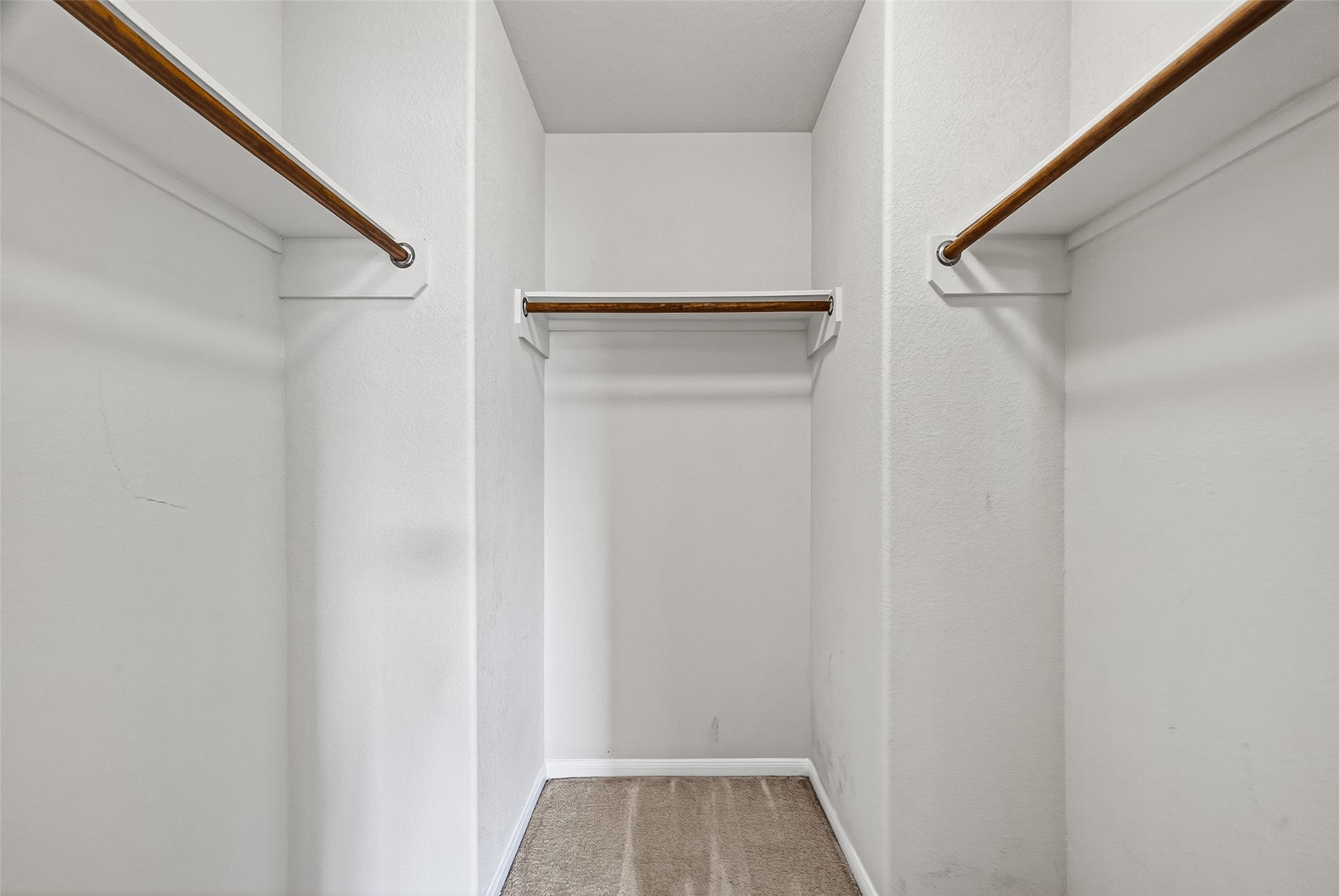 2702 Modano Court Fresno, TX 77545 - Photo 27 of 46 a view of walk in closet with empty racks