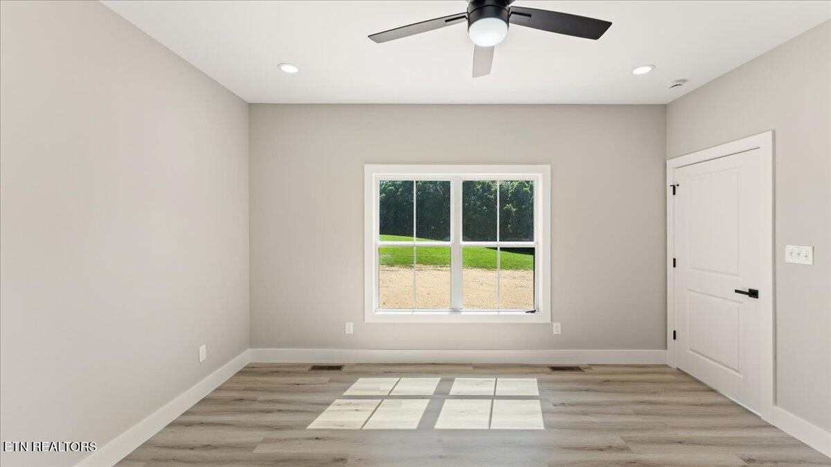 5817 Caldwell Road Loudon, TN 37774 - Photo 17 of 43 an empty room with a window and a ceiling fan