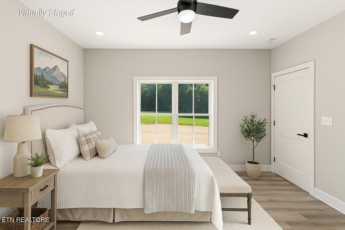 5817 Caldwell Road Loudon, TN 37774 - Photo 18 of 43 a bedroom with a bed and a large window