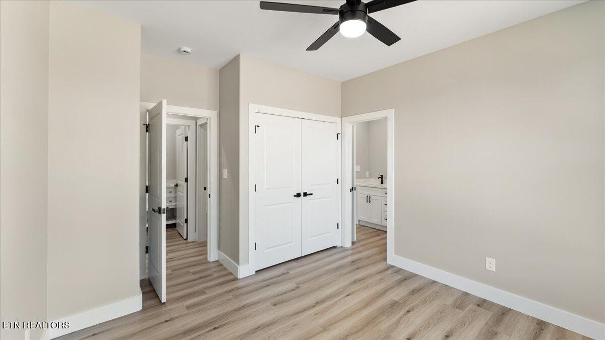 5817 Caldwell Road Loudon, TN 37774 - Photo 27 of 43 a view of a hallway with wooden floor and closet area