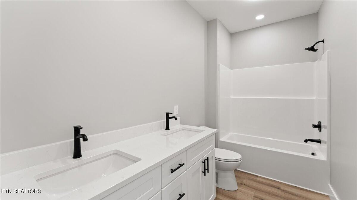 5817 Caldwell Road Loudon, TN 37774 - Photo 28 of 43 a bathroom with a granite countertop sink toilet and shower