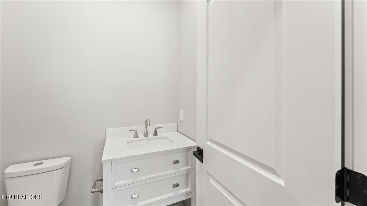 5817 Caldwell Road Loudon, TN 37774 - Photo 31 of 43 a bathroom with a sink toilet and vanity