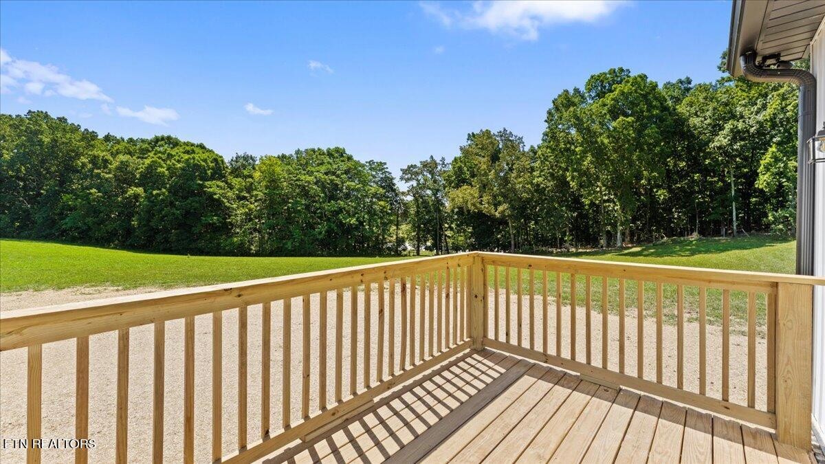 5817 Caldwell Road Loudon, TN 37774 - Photo 32 of 43 a view of deck and yard with green space