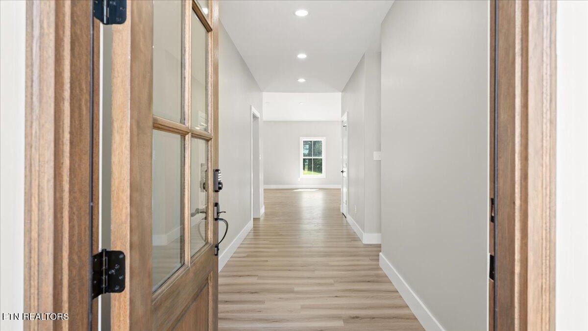 5817 Caldwell Road Loudon, TN 37774 - Photo 4 of 43 a view of a hallway with wooden floor and staircase