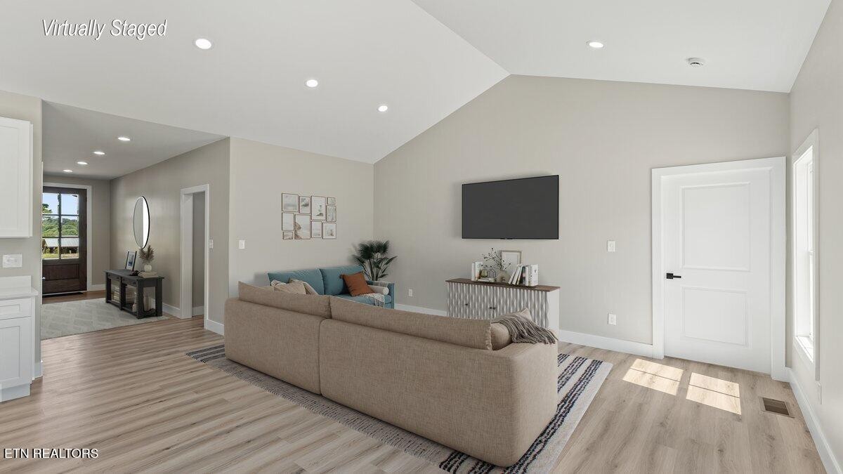 5817 Caldwell Road Loudon, TN 37774 - Photo 7 of 43 a living room with furniture and a flat screen tv
