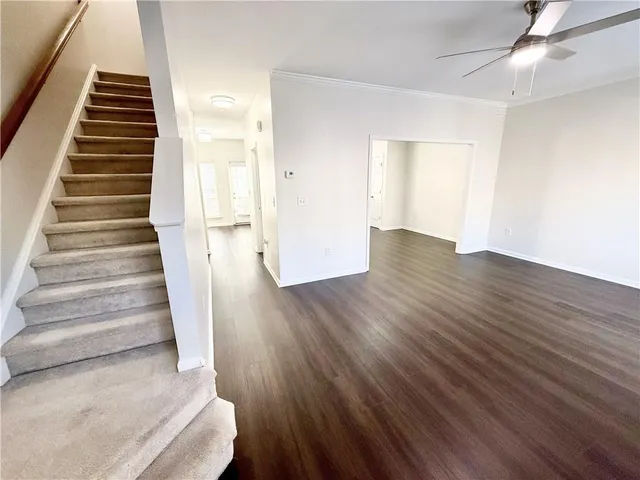 wooden floor in an empty room with a gallery