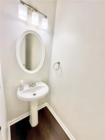 a bathroom with a sink a mirror and vanity