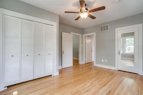 a kitchen with cabinets appliances and a window