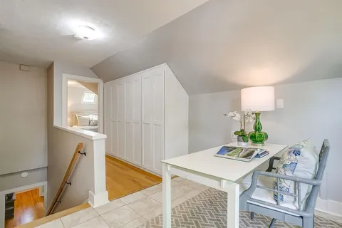 a bedroom with a bed and a lamp