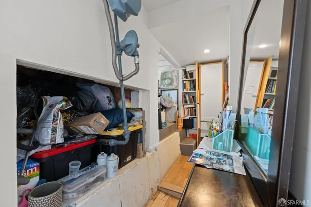 a living room with lots of furniture and wooden floor